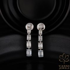 Experience unparalleled elegance with this intricately crafted earring set showcasing a combined weight of 5.31 total carats. Each earring features a pristine emerald cut lab-grown diamond, renowned for its elongated rectangular shape and stepped facets, which captures and reflects light spectacularly. Set in high-quality precious metal, these earrings are a testament to sustainable luxury and modern craftsmanship. Their exceptional clarity, coupled with a remarkable cut, ensures a shimmering display of brilliance and fire from every angle. Perfect for those special occasions or as an exquisite daily accessory, this pair promises a timeless appeal and a lasting impression. By choosing lab-grown diamonds, you're also making a conscious decision to support ethical and environmentally friendl Anniversary Wedding Gifts, 19 Days, Hand Crafted Jewelry, Crafted Jewelry, Anniversary Wedding, Precious Metal, Memorable Gifts, Emerald Cut, Last Minute Gifts