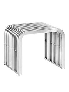 a white metal table with an arch design on the top and bottom, against a white background