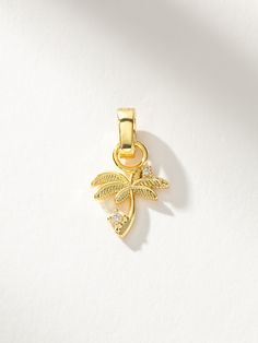 Bring a tropical feel to your look with our Palm Tree Charm. This gold charm features two shining stones and is the perfect addition to your charm necklace or charm bracelet. Want more palm tree styles? Be sure to check out the full collection. | Palm Tree Charm Jewelry in Gold | Uncommon James Uncommon James, Gold Charm, Cleaning Jewelry, Palm Tree, Charm Jewelry, Palm Trees, Charm Necklace, Polymer Clay, Charm Bracelet