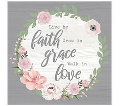 a sign that says, live by faith in grace walk in love with flowers around it