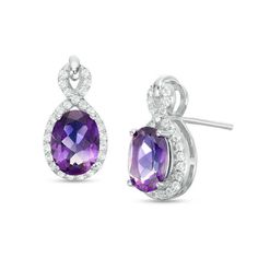 A splendid treat, these dazzling gemstone drop earrings are a captivating choice she’ll love. Fashioned in sterling silver, each luxe design showcases an 8.0 x 6.0mm oval-shaped bright purple amethyst center stone wrapped in a looping ribbon of glistening white topaz. Buffed to a brilliant luster and certain to stand out, these sparkling post earrings secure comfortably with friction backs. Amethyst Jewelry Ring, Purple Gemstone Jewelry, Zales Zales, Buckle Necklace, Dazzling Earrings, Luxe Design, Gemstone Drop Earrings, Jewelry Clasps, Gold Jewelry Indian