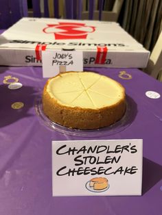 a cheesecake sitting on top of a purple table