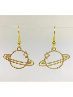 These celestial dangle earrings are an outline of planet Saturn with a twinkling star. Gold tone dangle & ear wires. Made by Simple N Great, a woman-owned business specializing in novelty earrings based out of Florida. 1.5" long. Saturn Outline, Planet Saturn, Novelty Earrings, Crystal Accessories, Toe Rings, Stone Bracelet, Sterling Ring, Chain Styles, Earring Necklace