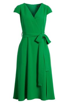 A vivid verdant hue and a graceful neckline define a work-to-weekend dress secured with a simple sash. 44" length Hidden back-zip closure Surplice V-neck Short sleeves Removable sash Lined 100% polyamide Dry clean Made in the USA of imported fabric Green Wrap Dress, Weekend Dresses, Surplice Dress, Midi Wrap Dress, Black Halo, Long Midi Dress, Dress Home, Pleated Midi Dress, Pink Midi Dress