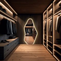 a walk in closet with wooden flooring and illuminated lighting on the walls, along with clothes