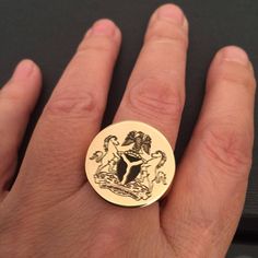 "Family Crest Engraved ring, Personalized Ring, gold ring - round seal. Engraved Signet ring with Round Seal- 18K Gold plated or sterling silver 925 - also suitable for men and women, Diameter: 2 cm = 0.78\" Please note in the \"notes to seller\" at checkout. : * state your ring size * picture / family crest you want me to engrave * Please attach in \"convo box\" the picture you want me to engrave in black and white clear lines - as high quality the pic is as good the result we get The product w Anniversary Coat Of Arms Signet Ring, Anniversary Signet Ring With Coat Of Arms, Engraved Signet Ring For Commemoration, 14k Engraved Ring For Commemoration, Gift Signet Ring With Coat Of Arms, Gift Coat Of Arms Signet Ring, Engraved Ring With Coat Of Arms As A Gift, Family Crest Ring, College Ring