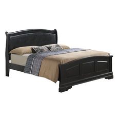 a black bed frame with two pillows on the headboard and foot board is shown