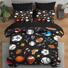 a bed with black comforters and sports themed sheets