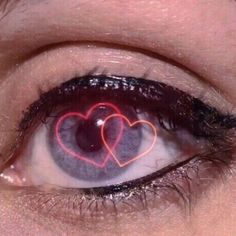 an eye with two hearts drawn on it's irise, and the reflection is in