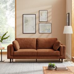 a living room scene with focus on the couch and coffee table in the foreground