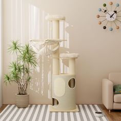 a cat tree in the corner of a living room with a clock on the wall