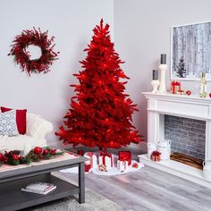 a red christmas tree in a living room