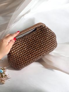 "Timeless and high quality handmade crochet knitted product  ✅A stylish women's accessory for daily use, special occasions, invitations, evenings! Wedding Party season  has begun and this bag will be the perfect choice 🤩 you will shine like a star All eyes will be on you this season with our trendy Metallic clutch lined with luxuriously matching Satin, metallic vegan leather and rich jewel tone colours, and you can be sure that these jewels will stand out in the crowd. Whether it's a night out, Gold Crochet Bag For Evening, Evening Crochet Clutch Bag, Chic Gold Crochet Evening Bag, Elegant Gold Crochet Clutch Bag, Handmade Brown Crochet Clutch Bag, Metallic Clutch, Jewel Tone Colors, Wedding Clutch, Purse Bag