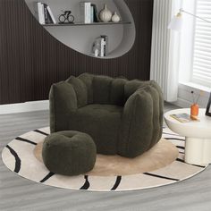 a living room with a chair and ottoman on the floor in front of a mirror