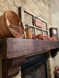 an old fireplace mantel with pumpkins and other fall decorations