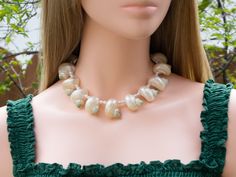 This elegant short choker necklace are made of pearlized turbo shells and freshwater pearl beads. Gorgeous and unique! Great idea for gift! 🎁 Necklaces - Length : approximately 14 1/2" long, strung with professional quality "Accu-Flex" 49 strands softest drape beading wire. Finished with 18k real gold plated toggle clasp. - Beads : approximately 20mm to 25mm white turbo shell and 5mm freshwater pearl. - These are made of natural organic real seashells, blemishes or imperfections are part of its Elegant Adjustable Shell Necklace With Pearl Pendant, Pearl Chain Shell Necklace, Mother Of Pearl Shell Necklace For Wedding, Pearl White Shell Necklace For Wedding, Elegant Adjustable Shell Necklace, Elegant Adjustable Shell Necklaces, Adjustable Elegant Pearl Necklace, Adjustable Elegant Mother Of Pearl Shell Necklace, Elegant Adjustable Shell Pearl Necklace