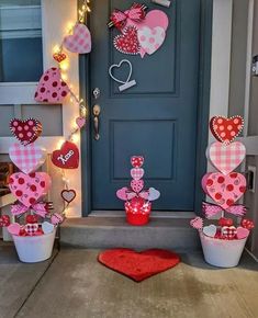 valentine's day decorations on the front steps of a house