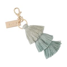 a keychain with tassels and a name tag on the front of it