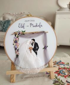 a wedding photo frame with a bride and groom on it, sitting on a table