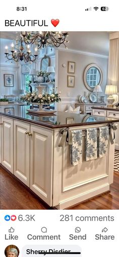 an image of a kitchen island with towels hanging from it's hooks and lights