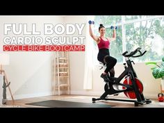 a woman is exercising on an exercise bike in her living room with the words full body cardio sculpt cycle bike boot camp