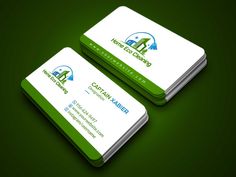 two green and white business cards with the logo of an energy company on them,