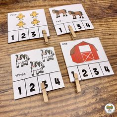 four farm animals on clothes pegs to match the numbers in this counting game for toddlers