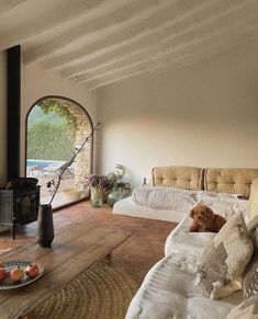 a living room filled with furniture and a fire place