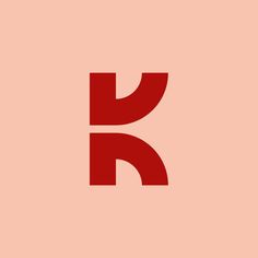 the letter k is made up of two red letters on a light pink background,