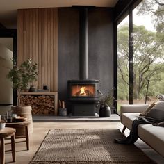 a living room filled with furniture and a fire place in the middle of it's walls