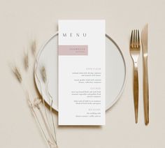 a menu on a plate next to a fork, knife and utensils in front of it