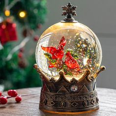 a snow globe sitting on top of a wooden table