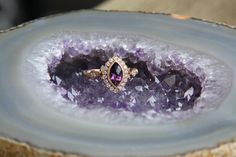 Vintage style ring set with a .85 carat Marquise faceted Amethyst, along with .20 cttw of natural round brilliant cut diamonds, complete in a 14 karat Rose gold vintage filigree style setting. Beautiful as a unique engagement ring, or just another piece to add to your collection.  Amethyst is the birthstone for February and one of the emblems of the twelve apostles. Fine amethysts have been set in religious jewelry and royal crown jewels for ages. It was once considered equal in value to ruby, emerald, and sapphire. Amethyst Diamond Ring With Rose Cut Diamonds For Anniversary, Amethyst And Diamond Ring With Vvs Clarity For Wedding, Purple Rose Cut Diamond Ring, Purple Diamond Ring With Rose Cut Diamonds, The Twelve Apostles, Royal Crown Jewels, Twelve Apostles, Vintage Style Rings, Amethyst Gem