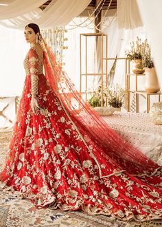 a woman in a red bridal gown