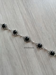 Bracelet made of black onyx stone. Black onyx is a stone of protection, it protects from the evil eye, it repels the presence of spirits who would try to influence you, it is very useful for mediums. It promotes a sense of responsibility and helps to maintain self-control by being more composed. Dimensions: 18 centimeters long and 1.3 centimeters wide If you want, I can add an extension chain. Materials used: zinc alloy and onyx (each natural stone being unique, they cannot be identical to the p Medieval Goth, Punk Tattoo, Rock Tattoo, Viking Metal, Gothic Bracelet, List Of Flowers, Gothic Aesthetic, Black Onyx Stone, Self Control