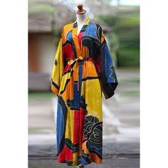 To wear this robe is to wear a colorful allegory of tradition, with a myriad shapes and patterns revel in blue and fuchsia, yellow, orange, and green. Yin yang emblems, exotic flowers, and starfish float through the folds with every movement. Ideal for a stroll on a warm summer evening. This hand-painted batik robe is a truly original work of art. Sunlight, water, dye and temperature all factor into the look of the finished robe. This should be considered a unique design made especially for you. Green Yin Yang, Spirit Clothing, Fair Trade Clothing, Batik Art, Batik Pattern, Orange And Green, Summer Evening, Exotic Flowers, Yellow Orange