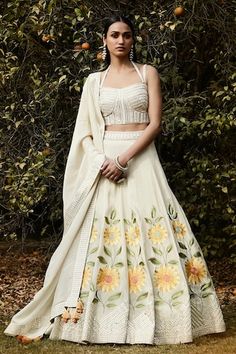 Ivory lehenga with an attached cancan, thread work sunflower motifs, mirrors and pipe work embroidery. Comes with mirror and cut pipe embroidered padded and matching dupatta. - Aza Fashions Lehenga Pattern, Thread Work, Aza Fashion, Lehenga, Sunflower, Types Of Sleeves, Fabric, Pattern