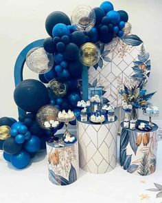 blue and white balloons, silver vases and other decorations