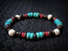 🎁 Explore the enchanting blend of Howlite and Turquoise in this bracelet, crafted in a boho style with 6mm beads, making it a unisex piece of handmade jewelry. Ideal as a thoughtful gift for a sister or friends, this accessory carries the significance of being a Sagittarius birthstone, adding a touch of personal charm to its allure. Material details: -6mm Turquoise -6mm Howlite -5mm Coco Wood -4mm Red Coral -4mm Black Agate PACKAGING * Each piece of our bracelet is packaged in a black gift box Southwestern Natural Stones Beaded Bracelet Gift, Handmade Rustic Beaded Bracelets, Southwestern Gemstone Beaded Bracelets For Healing, Handmade Southwestern Healing Bracelets, Rustic Handmade Bracelet With Round Beads, Bohemian Bracelets With Spacer Beads, Southwestern Style Beaded Bracelets With Round Beads For Healing, Southwestern Style Healing Round Beaded Bracelets, Bohemian Beaded Bracelets For Healing