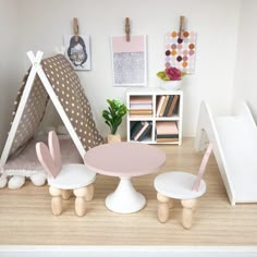 a doll house with furniture and accessories on the floor in front of a teepee tent