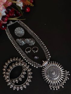 Shop this unique antique looking set handcrafted with love by the experienced craftsmen just for you. you can pair the set with ethnic attire as well as casual to have a statement fusion look. This set of 6 includes Long with pendant, earrings, nose pin, pair of bangle, toe ring and Ring. Premium quality!! Bohemian Jewelry Sets With Intricate Design For Festive Occasions, Bohemian Jewelry Sets With Intricate Design, Handmade Traditional Metal Jewelry Sets, Traditional Handmade Metal Jewelry Set, Bohemian Metal Jewelry Sets With Intricate Design, Bohemian Round Jewelry Sets For Festivals, Ceremonial Silver Tilla Jewelry Sets, Silver Temple Jewelry With Motifs, Silver Tilla Jewelry Sets For Ceremonial Occasions