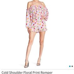 Cold Shoulder Romper Has Gathered Neckline And Ruffed Bottom. Elastic At Waist And Bottom Of Sleeves. Size Small Spring Off-shoulder Jumpsuits And Rompers, Off-shoulder Jumpsuits And Rompers For Spring, Trendy Off-shoulder Jumpsuits And Rompers For Spring, Summer Off-shoulder Loungewear Jumpsuits And Rompers, Casual Off-shoulder Jumpsuit For Spring, Feminine Spring Long Sleeve Jumpsuits And Rompers, Spring Floral Print Loungewear Jumpsuits And Rompers, Pink Printed Jumpsuits And Rompers For Spring, Feminine Long Sleeve Jumpsuits And Rompers For Summer