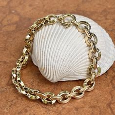 14KT yellow gold knife-edge, oval, interlocking chain link bracelet with toggle clasp. Great, chunky links bracelet to wear on its own or with an arm full of bracelets! Length: 8" Chain width: 7.95mm Weight: 9.25 grams Stamped 14K Easy to use toggle clasp Made in Italy Luxury Oval Link Box Chain Bracelet, Luxury Yellow Gold Statement Chain Bracelet, Luxury Oval Link Chain Bracelet With Gold Clasp, Gold Knife, Gold Models, Toggle Clasp, Chain Link Bracelet, Link Bracelets, Chain Link