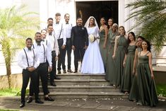 a group of people that are standing on some steps