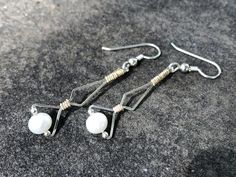 These dangle/drop earring were hand wrapped using only the finest Argentium Silver wire and 14 karat yellow gold filled wire.  Intricately woven with time and care one piece at a time.  Never mass produced.  The ear hooks are fine Argentium Silver. Argentium silver is a finer quality than traditional sterling, yet is extremely resistant to tarnish.  All of my Argentium silver is nickel free.  They are light weight and are a unique, eye catching addition to any collection.  Available in all silve Elegant Adjustable Wire Wrap Earrings, Elegant Wire Dangle Wrap Earrings, Elegant Wire Wrap Dangle Earrings, Elegant Handmade Wire Wrap Earrings, Elegant Handmade Wrap Wire Earrings, Elegant Dangle Wrap Earrings, Elegant Silver-plated Wire Wrapped Earrings, Elegant Gold Earrings With Silver Plated Wire, Elegant Gold-colored Silver-plated Earrings