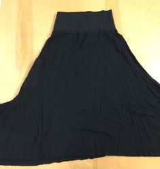 "This fun, A-line skirt is made from our medium weight 55%hemp/45%organic cotton jersey, is so comfortable and flattering with it's non-linear hemline, and shapely side patch pocket. It's wide 53% hemp/43% organic cotton/45% spandex stretch jersey waistband is designed to hug and support the low rise waistline (works well as a maternity skirt). The Forest skirt's hemline has a fun, raw edge for it's natural curly flow. This skirt gives you that comfortable everyday wear quality. Available in S-X Casual Solid A-line Maxi Skirt, Casual A-line Maxi Skirt With Elastic Waistband, Spring Casual Maxi Skirt With Wide Hem, Casual Wide Hem Maxi Skirt For Spring, Solid Color Cotton Stretch Maxi Skirt, Solid Color Stretch Cotton Maxi Skirt, Casual Flared Skirt With Wide Waistband, Casual Cotton Maxi Skirt With Pockets, Casual Maxi Skirt With Elastic Waistband For Loungewear