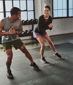 two people in a gym doing exercises together