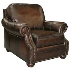 a brown leather chair with studding on the arms