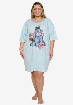 Lounge around with this adorable sleep shirt with Eeyore adorning the front!FABRIC: Cotton/PolyesterT-Shirt features a graphic print of Eeyore sitting drinking hot cocoa on the front. Text on Mug reads "Eeyore".Crew-neck, Light Blue color.60% cotton / 40% Polyester. Comfy, great quality fabric.Women's Sizing: One Size Plus (fits most 1X-4X).One Size PLUS measurements: underarm to underarm (laid flat)=32" & length from shoulder (high point)=39".Officially Licensed Disney Apparel! | Plus Size Wome Disney Apparel, Disney Eeyore, Night Pajama, Loungewear Dresses, Swimsuits For All, Disney Ladies, Sleep Shirt, Disney Tops, Disney Outfits