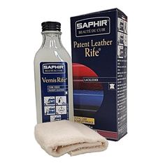 a bottle of leather cleaner next to a white towel and box with the same product on it